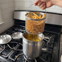 Lifting the fry basket out of the Oil Strainer Pot